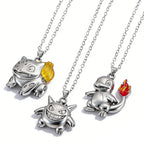 Pokémon character pendant necklaces displayed together on a light surface
