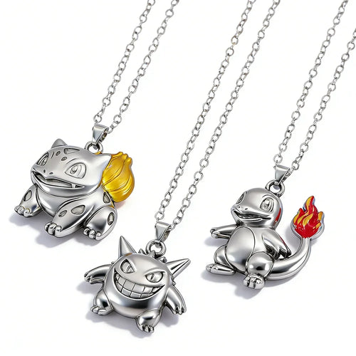 Pokémon character pendant necklaces displayed together on a light surface